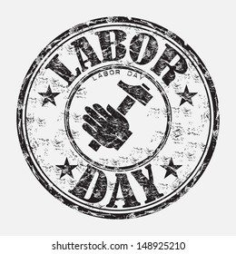 Black grunge rubber stamp with a hand holding a hammer and the text labor day written with capital letters