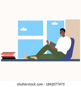 
Black guy reads a book while sitting on the window during quarantine. Cartoon vector illustration in flat style. A young man in a warm sweater with a book in his hands studies at home. Rest 