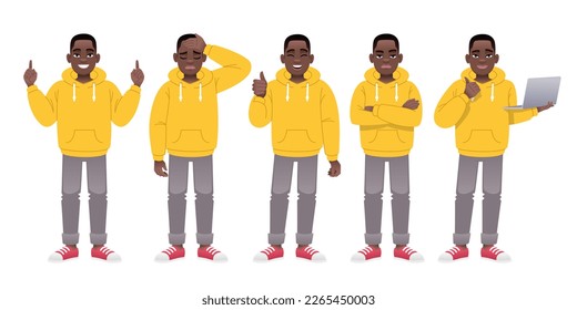 Black guy stands with a laptop, arms crossed, in sadness, pointing at something, a gesture of approval. A young black man in a yellow hoodie and gray jeans is standing in different poses.