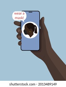 La mano de un negro con un smartphone y una burbuja de voz: llevar una máscara. Chica negra con logo en la máscara. Fondo azul. Ilustración plana.