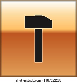 Black Hammer icon isolated on gold background. Tool for repair. Vector Illustration