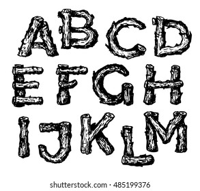 Black hand drawn alphabet font made from oak wooden sticks