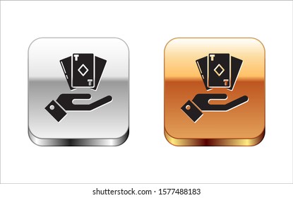 Black Hand holding deck of playing cards icon isolated on white background. Casino gambling. Silver-gold square button. Vector Illustration