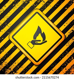 Black Hand holding a fire icon isolated on yellow background. Insurance concept. Security, safety, protection, protect concept. Warning sign. Vector