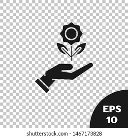 Black Hand holding flower icon isolated on transparent background. Seed and seedling. Planting sapling. Ecology concept.  Vector Illustration