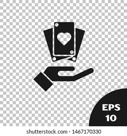 Black Hand holding playing cards icon isolated on transparent background. Сasino game design.  Vector Illustration