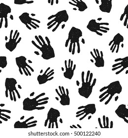 Black hand prints on white background. Black and white vector seamless pattern.