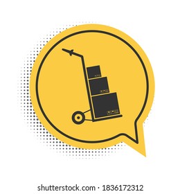 Black Hand truck and boxes icon isolated on white background. Dolly symbol. Yellow speech bubble symbol. Vector.
