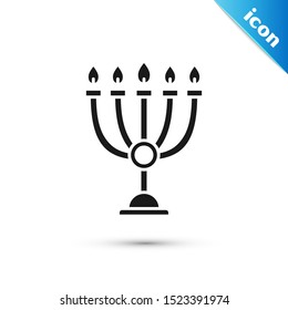 Black Hanukkah menorah icon isolated on white background. Hanukkah traditional symbol. Holiday religion, jewish festival of Lights.  Vector Illustration