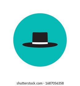 Black hat icon on turquoise circle background. Clothes vector sign