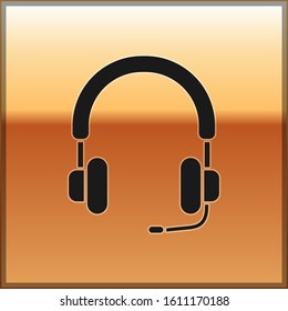 Black Headphones icon isolated on gold background. Earphones. Concept for listening to music, service, communication and operator.  Vector Illustration