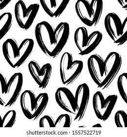 Black heart seamless pattern. Black and white ink brush hearts hand drawn ornament. Love symbols vector illustration. Monochrome freehand dry paint brush stroke shapes. Decorative textile, wallpaper.