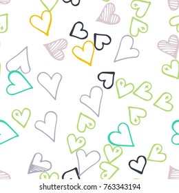 Black hearts seamless pattern. Scattered little gray, yellow, green love symbols. Endlessly repeating falling sketch heart shape on white valentine background. Hand draw texture. Vector illustration.