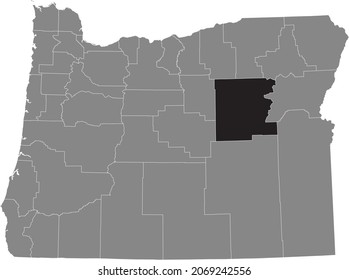 Black highlighted location map of the Grant County inside gray administrative map of the Federal State of Oregon, USA