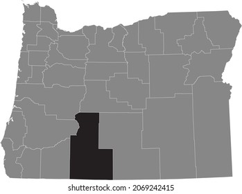 Black highlighted location map of the Klamath County inside gray administrative map of the Federal State of Oregon, USA