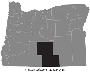 Black highlighted location map of the Lake County inside gray administrative map of the Federal State of Oregon, USA