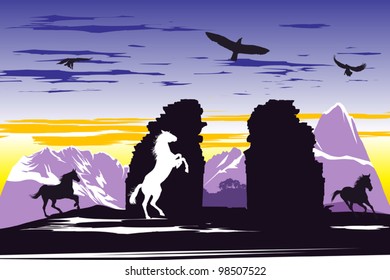 Black horses near the broken rocks on the dawn background