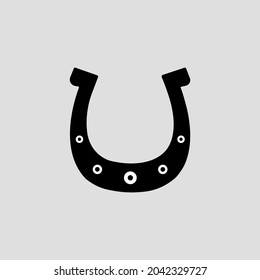 A black horseshoe on white background