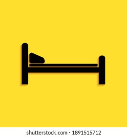 Black Hospital Bed icon isolated on yellow background. Long shadow style. Vector.