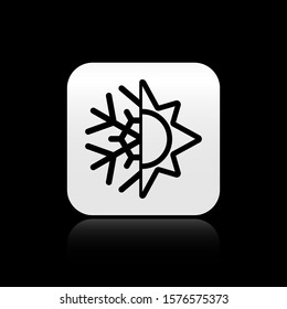 Black Hot and cold symbol. Sun and snowflake icon isolated on black background. Winter and summer symbol. Silver square button. Vector Illustration