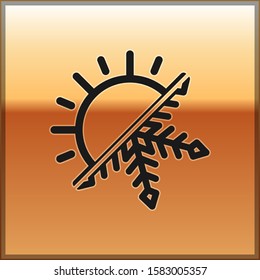 Black Hot and cold symbol. Sun and snowflake icon isolated on gold background. Winter and summer symbol.  Vector Illustration