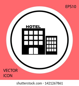 Black Hotel building icon isolated on red background. White circle button. Vector Illustration