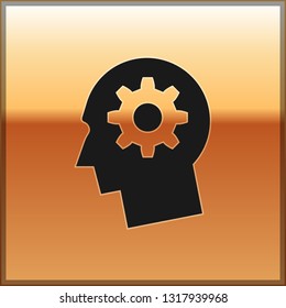Black Human head with gear inside icon isolated on gold background. Artificial intelligence. Thinking brain sign. Symbol work of brain. Vector Illustration