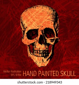 Black human skull with a lower jaw on dark textured background