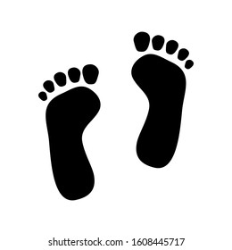 Black icon of human footprints. Vector illustration.