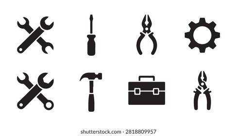 Black icon set of essential repair tools including open end wrenches screwdriver hammer pliers and a storage box.