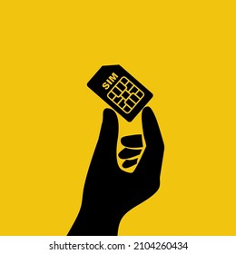 Black icon sim card in hand. Human holding sim card. Vector illustration flat design. Isolated on background. Mobile element.