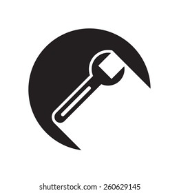 black icon with spanner and white stylized shadow