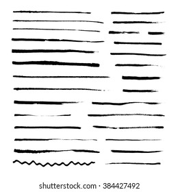 Black ink distressed strokes. Set of grunge artistic vector brushes isolated on white background. Abstract paint smears. 