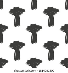 Black ink palm trees isolated on white background. Monochrome seamless pattern. Vector flat graphic hand drawn illustration. Texture.