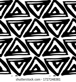 Black ink triangles isolated on white background. Seamless pattern. Hand drawn vector graphic illustration. Texture.