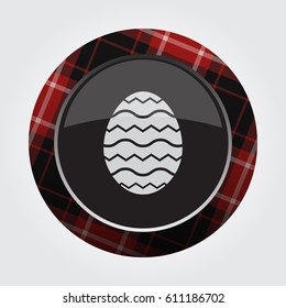 black isolated button with red, black and white tartan pattern on the border - light gray Easter egg with waves icon in front of a gray background