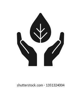 Black isolated icon of plant in hands on white background. Silhouette of leaf and hands. Symbol of care, protection, charity. Flat design.
