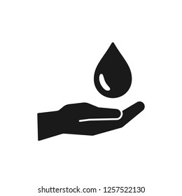 Black isolated icon of water drop, oil in hand on white background. Silhouette of aqua drop and hand. Symbol of care, charity. Save water. Flat design.