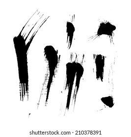 Black isolated ink blots and strokes with messy drops