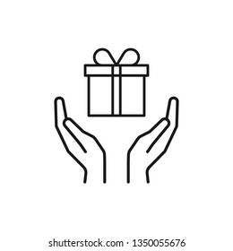 Black isolated outline icon of gift box in open hands on white background. Line icon of gift box and two hands. Give, make a present.