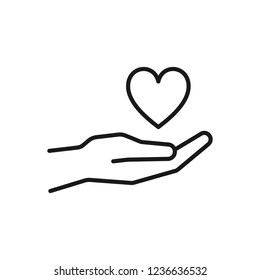 Black isolated outline icon of heart in hand on white background. Line Icon of heart and hand. Symbol of care, love, charity.