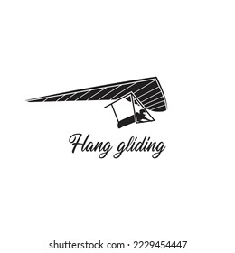 Black isolated silhouette of hang glider on white background.