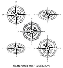 Black isolated wind rose compass set. Grunge and perspective circle navigation objects