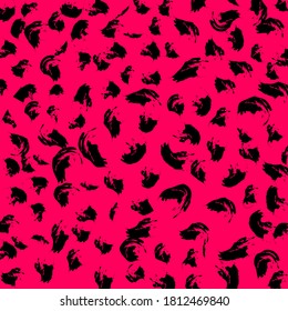 Black jaguar pattern on the pink background. Grunge vector pattern