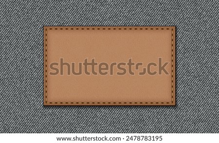 Black jeans texture. Denim background. Leather badge, denim label.