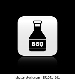 Black Ketchup bottle icon isolated on black background. Barbecue and BBQ grill symbol. Silver square button. Vector Illustration