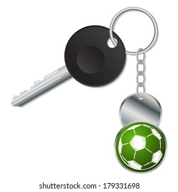 Black key with metallic soccer ball keyholder on white