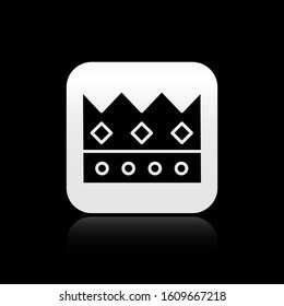 Black King crown icon isolated on black background. Silver square button. Vector Illustration