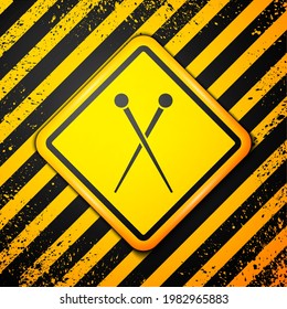 Black Knitting needles icon isolated on yellow background. Label for hand made, knitting or tailor shop. Warning sign. Vector Illustration