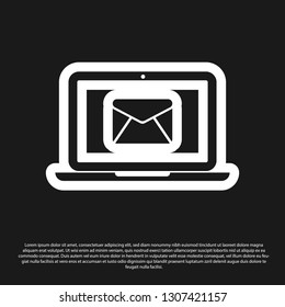 Black Laptop with envelope and open email on screen icon isolated on black background. Email marketing, internet advertising concepts. Vector Illustration